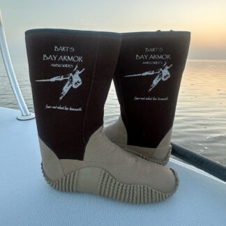 A pair of boots on the side of a boat.