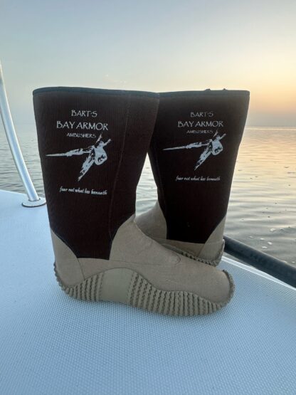 A pair of boots on the side of a boat.