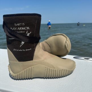 A pair of boots sitting on top of a boat.