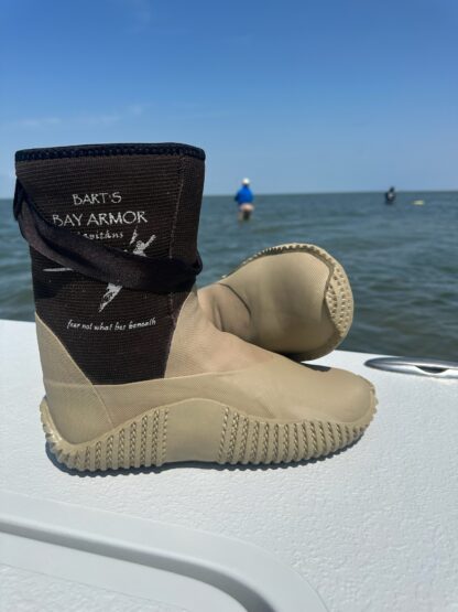 A pair of boots sitting on top of a boat.